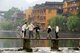 China: Crossing the old wooden bridge across the Tuo River, Fenghuang, Hunan Province